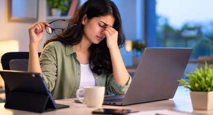 Woman experiencing eye strain from screen time